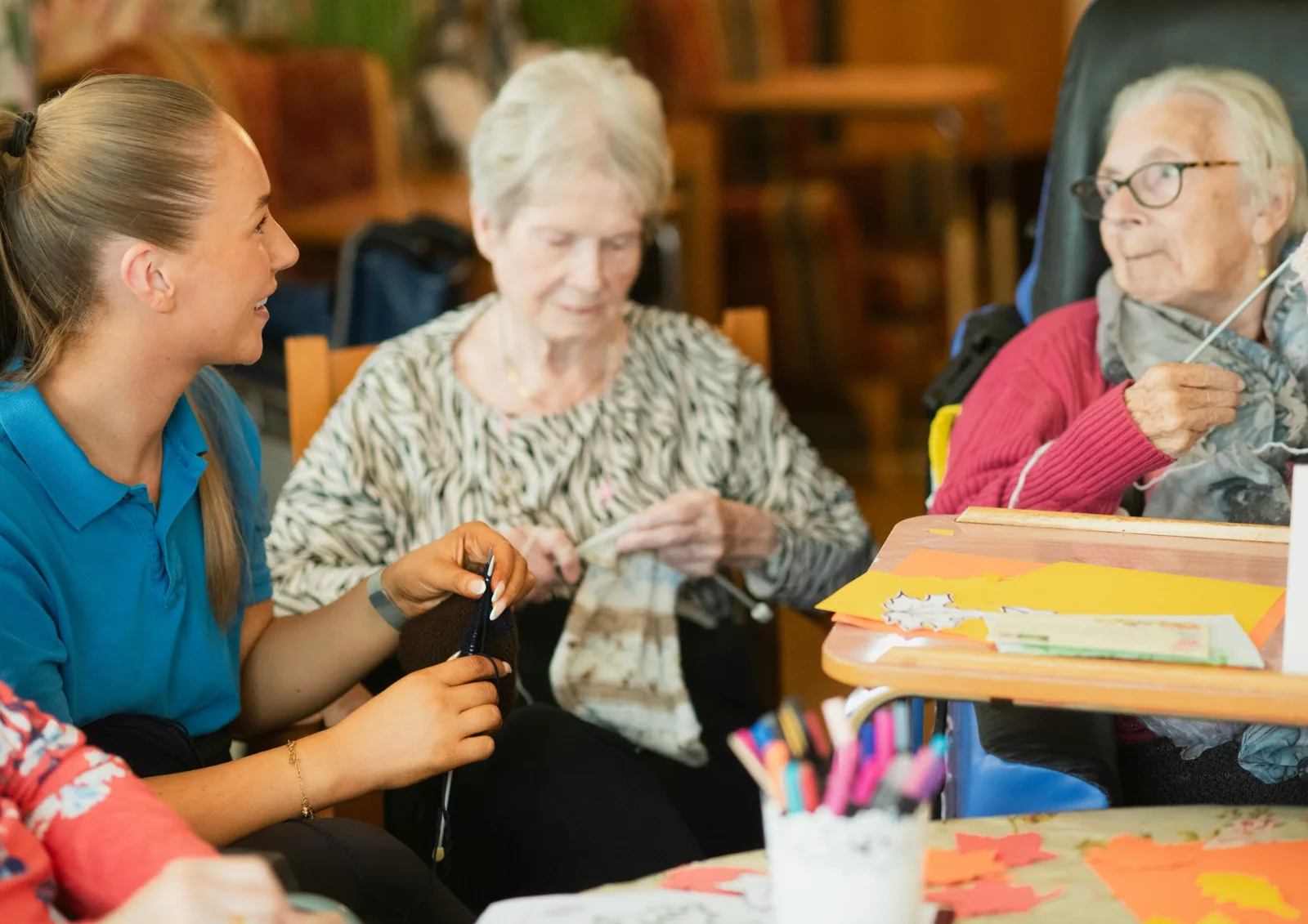 A carer spending time with older people during a meaningful activity